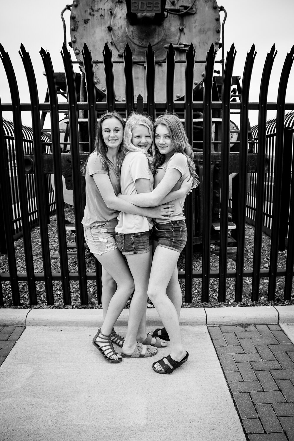 black and white picture of 3 teen girls 