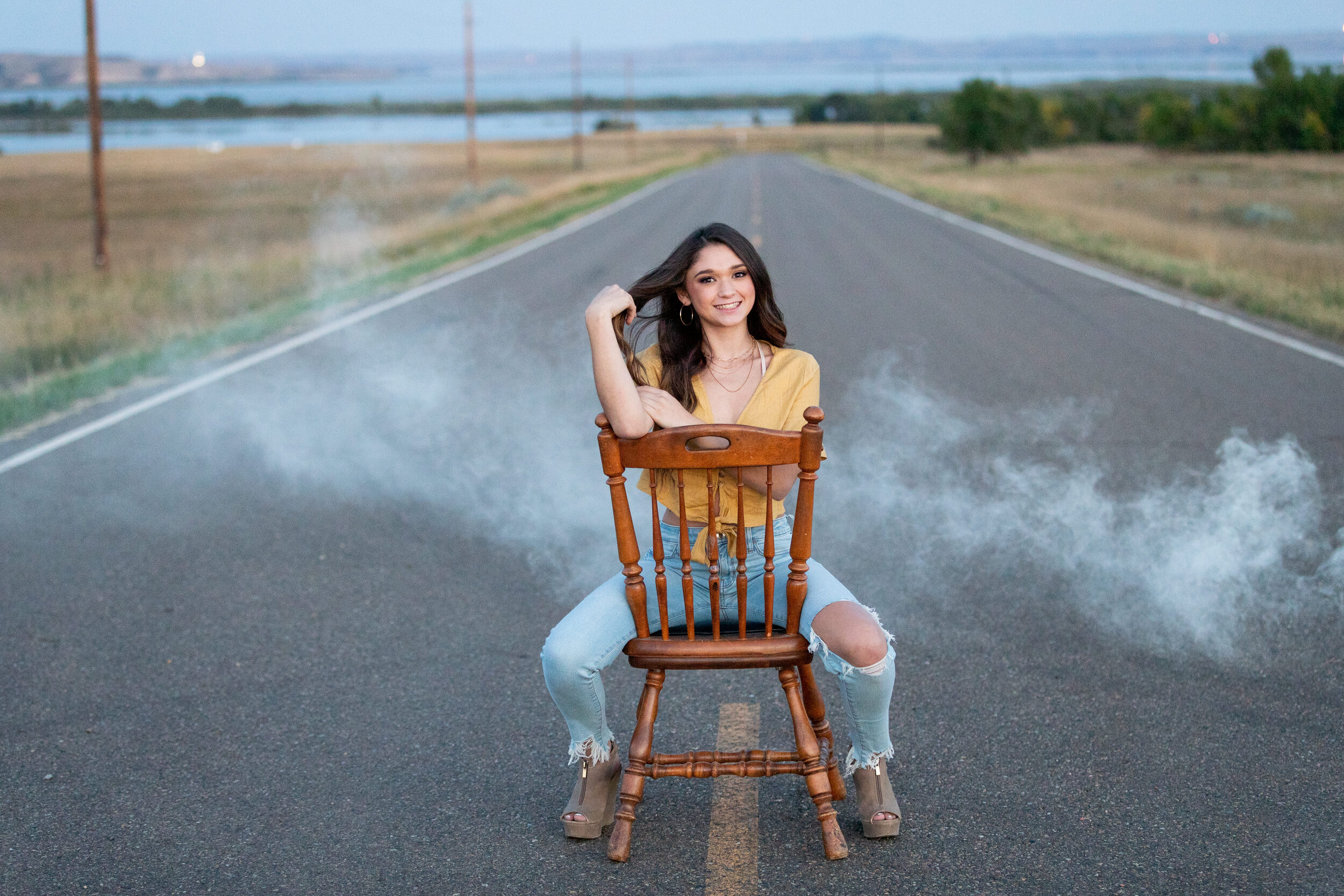 Senior girl on chair with white smoke 