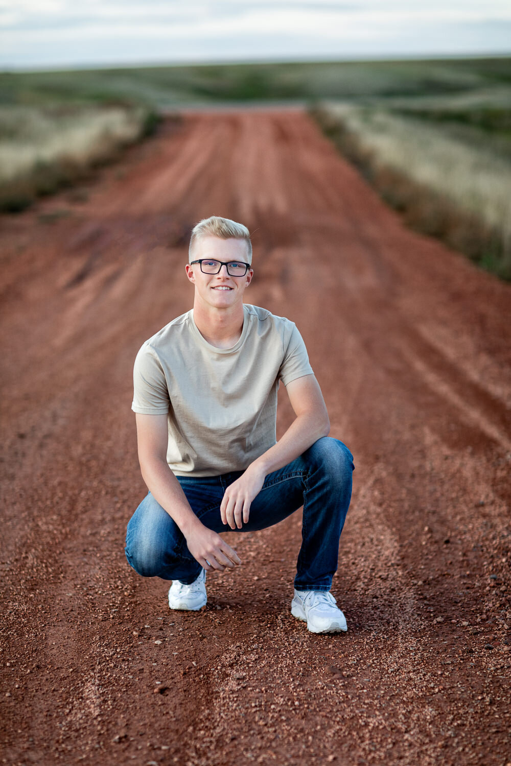 Senior boy on red dirt road