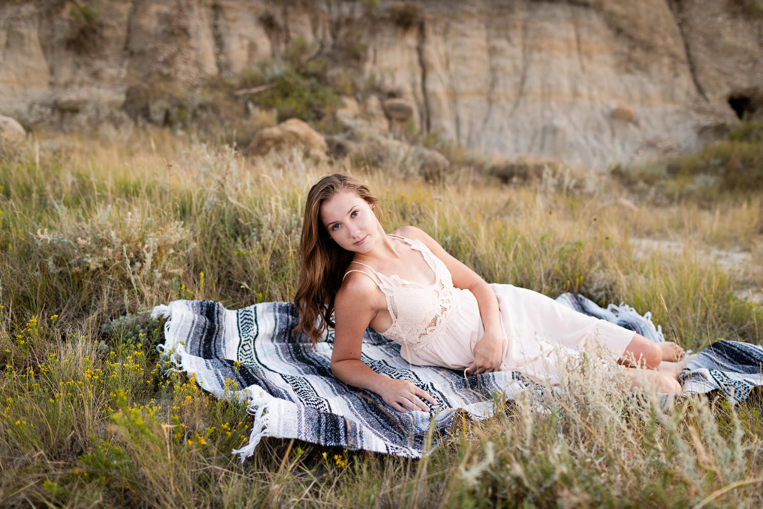 Senior girl on blanket in field