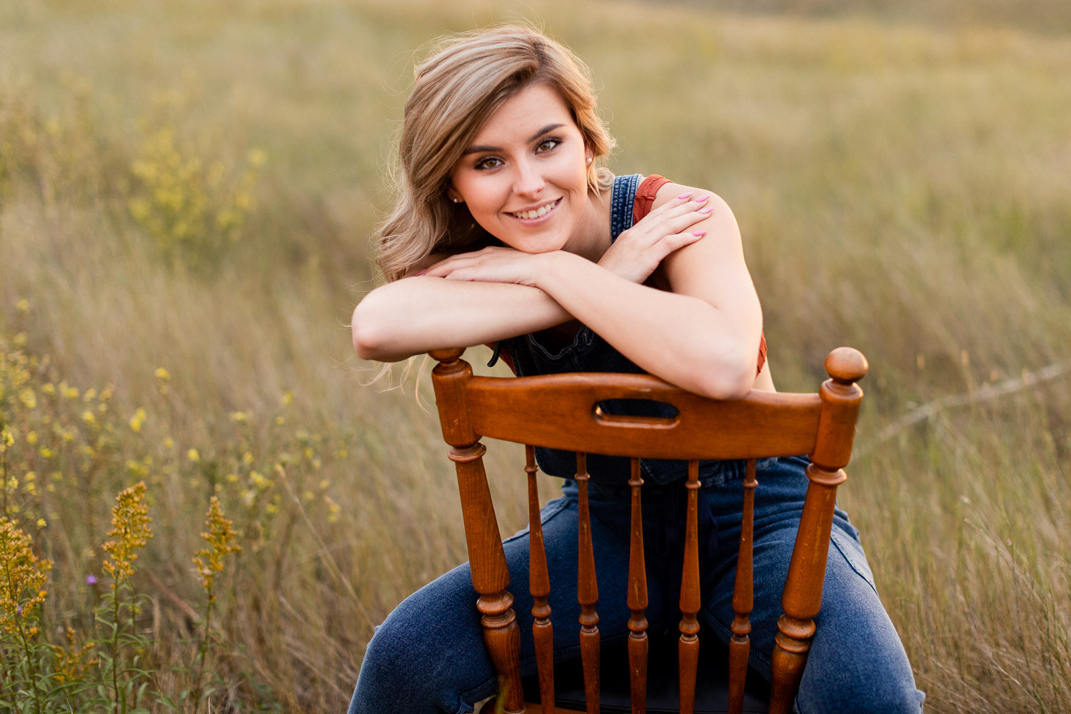 teenage girl sitting on a chair