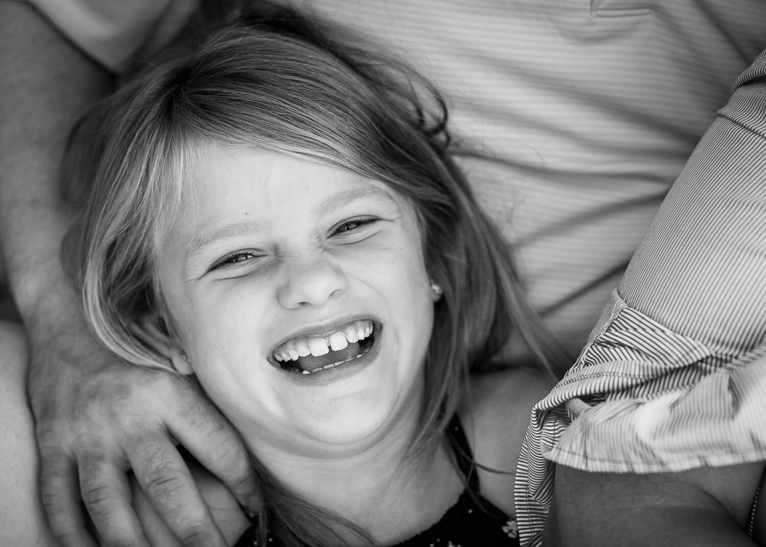 Black and white of daughter laughing 