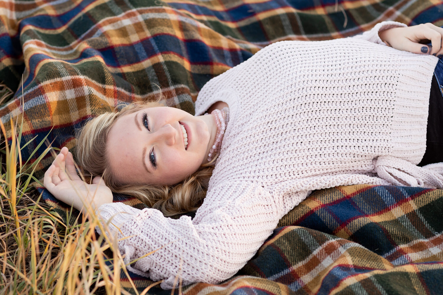 Gwen laying on a wool blanket