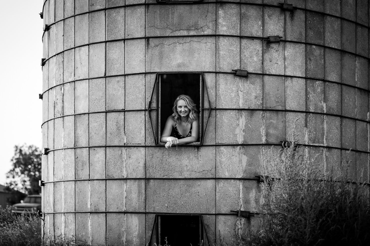 Black and white of senior girl in a tower