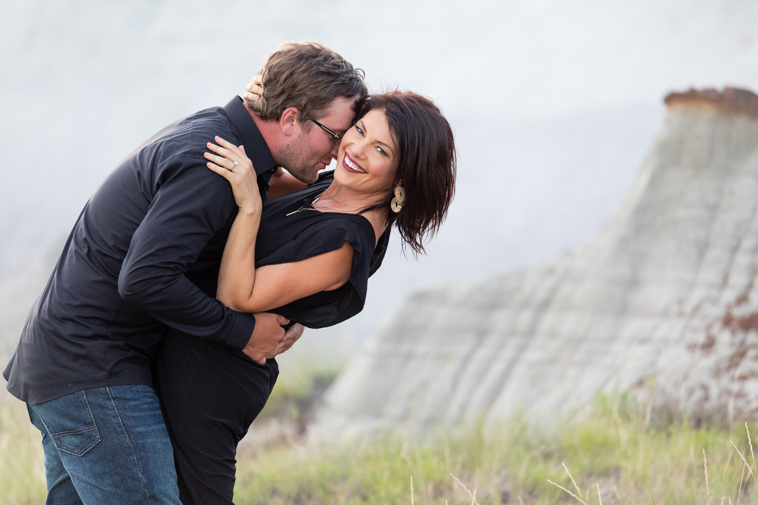Couple embracing in badlands 