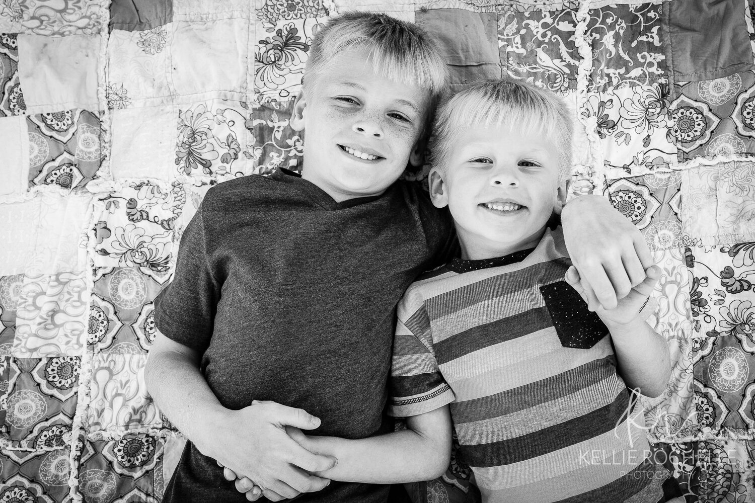 Black and white of brothers on blanket