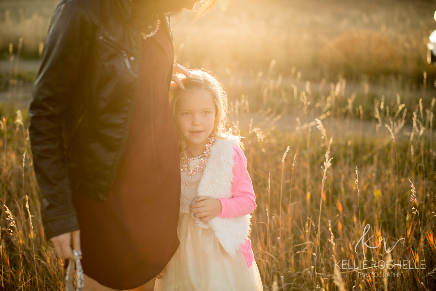 sun haze in a wheat field, young girl