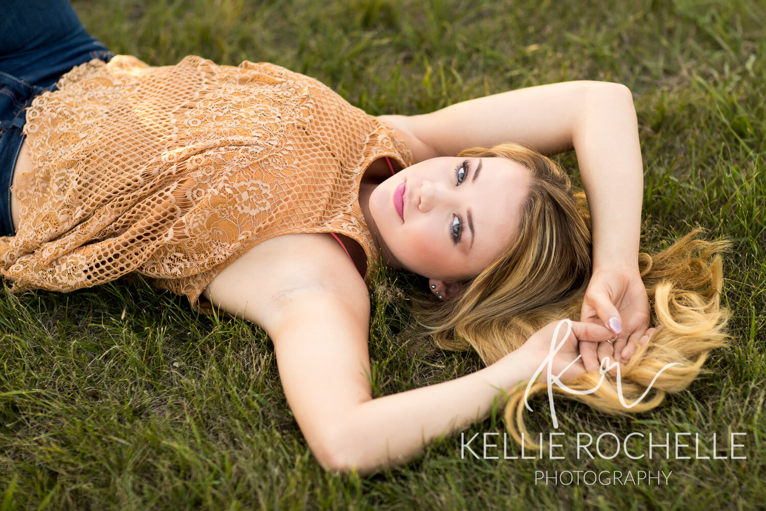 Teen laying in grass