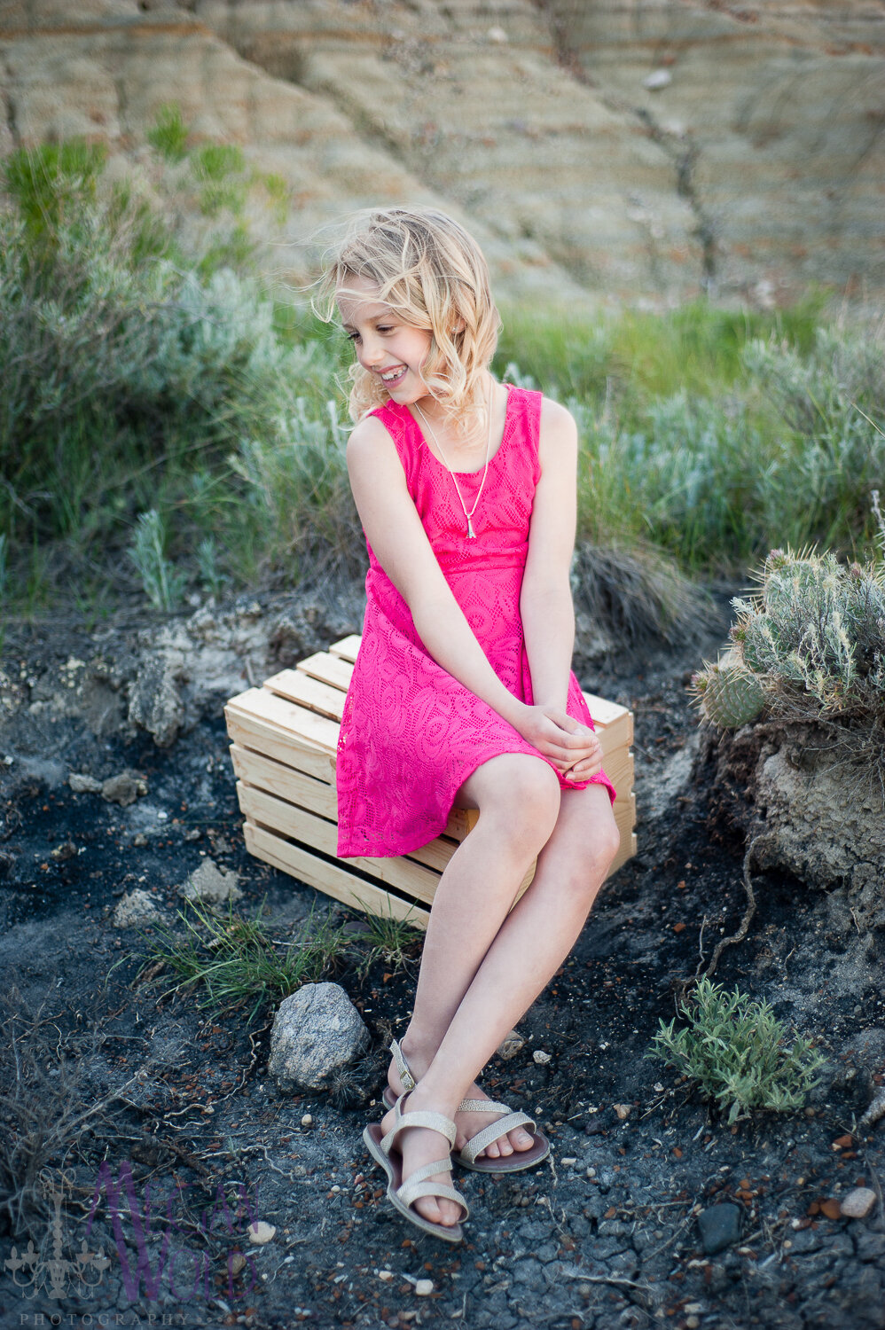 girl in pink dress sitting