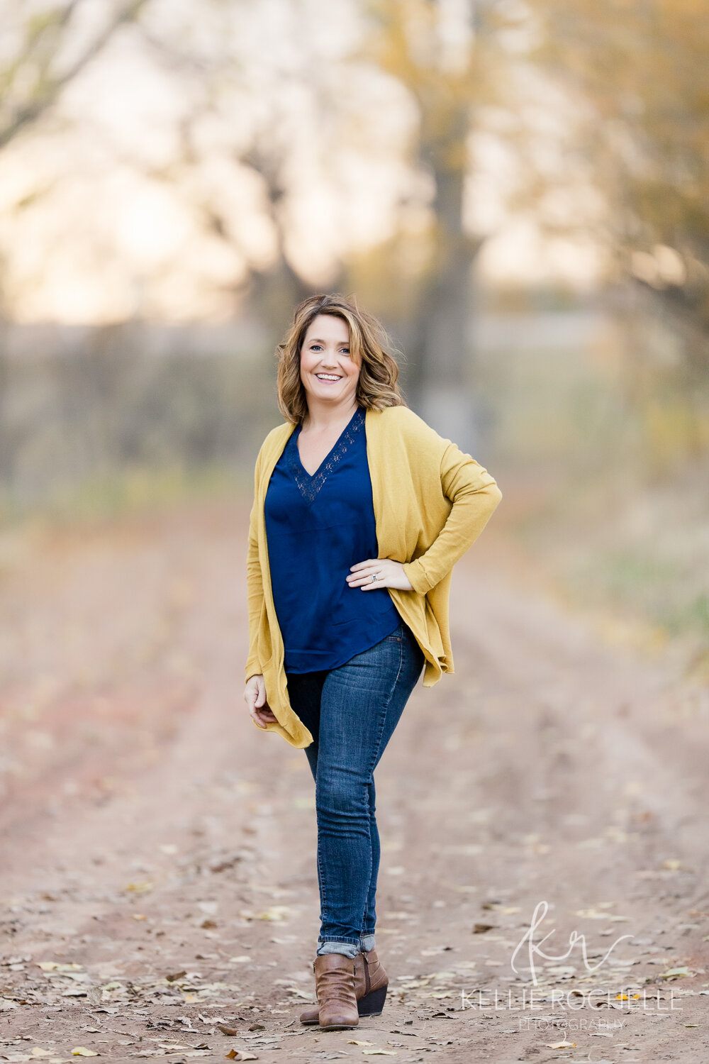 women full body picture with yellow and navy clothing