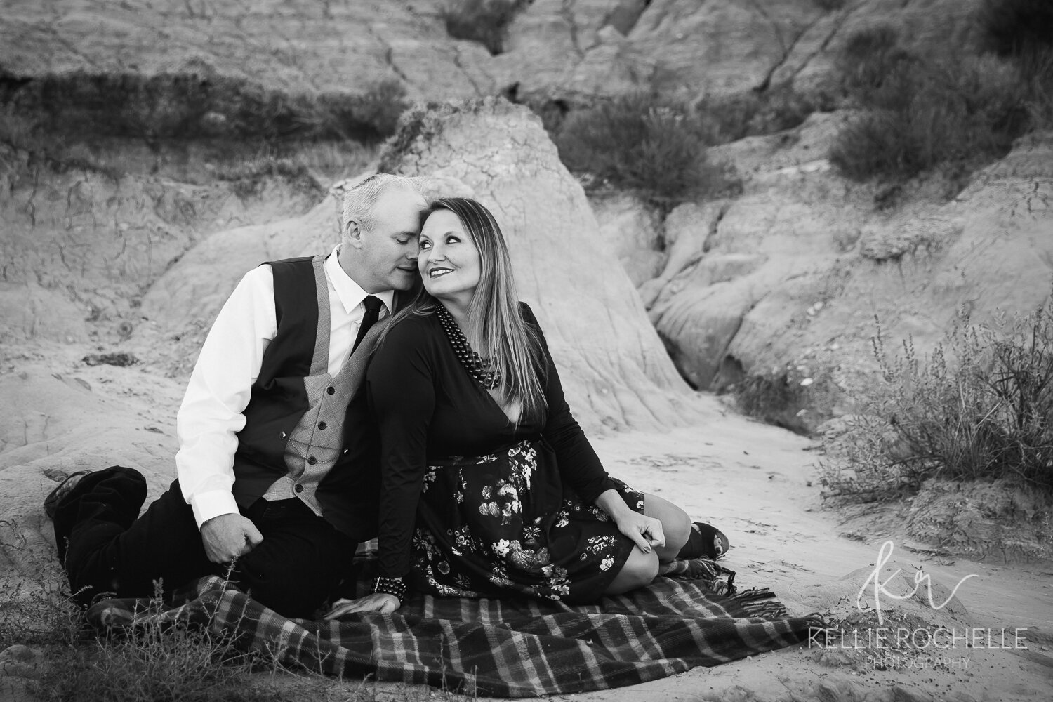 Couple sitting in black and white