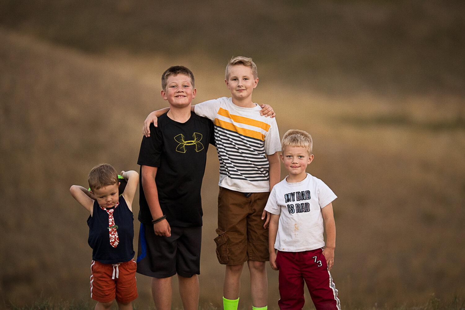 Boys standing together outside in summer - Williston children photographer