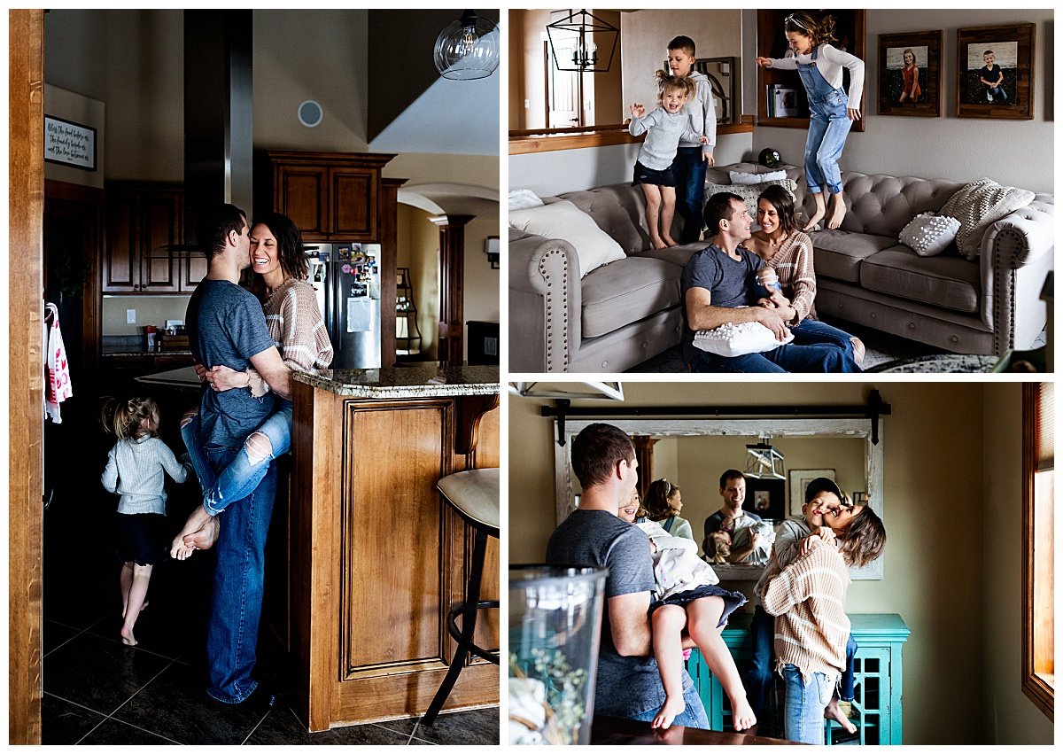 A brunette couple play with their three young children, including bouncing on the living room furniture of their North Dakota home during an in-home family photo session.