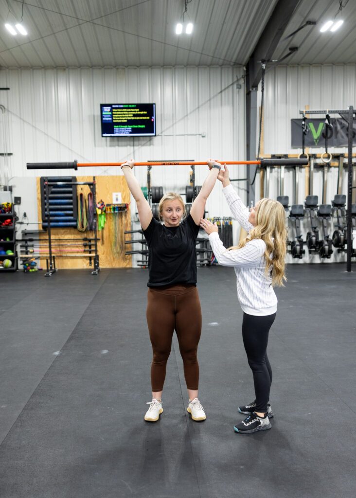 CrossFit Vokse owner, Kallie, is pictured in a training session in her Williston, ND-based gym during a branding session with Kellie Rochelle Photography.