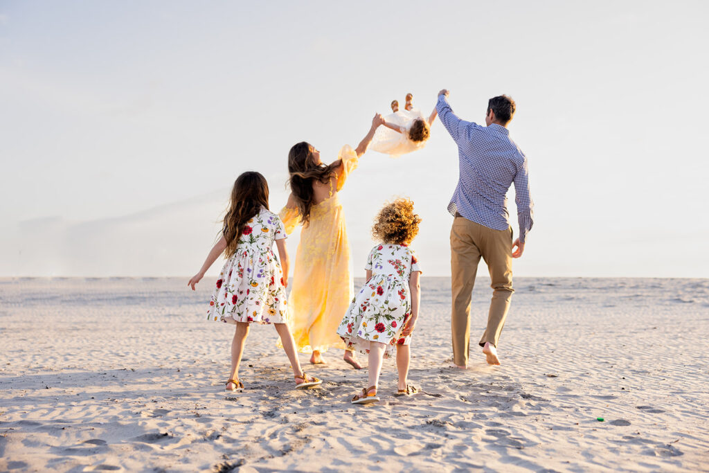 Family photos taken on a California beach by Kellie Rochelle Photography as part of a photography education retreat