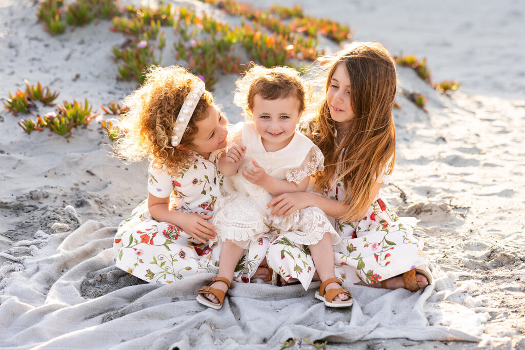 Family photos taken on a California beach by Kellie Rochelle Photography as part of a photography education retreat