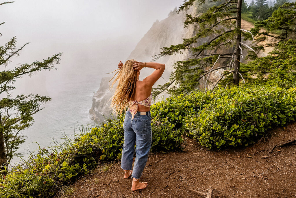 Kaitlyn at Devil’s Cauldron, with dramatic coastal scenery in the background.
