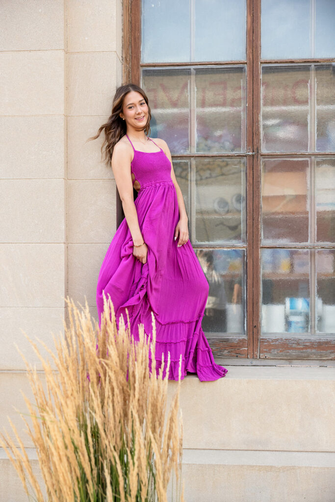 Downtown city senior session featuring Bonny in an elegant urban outfit