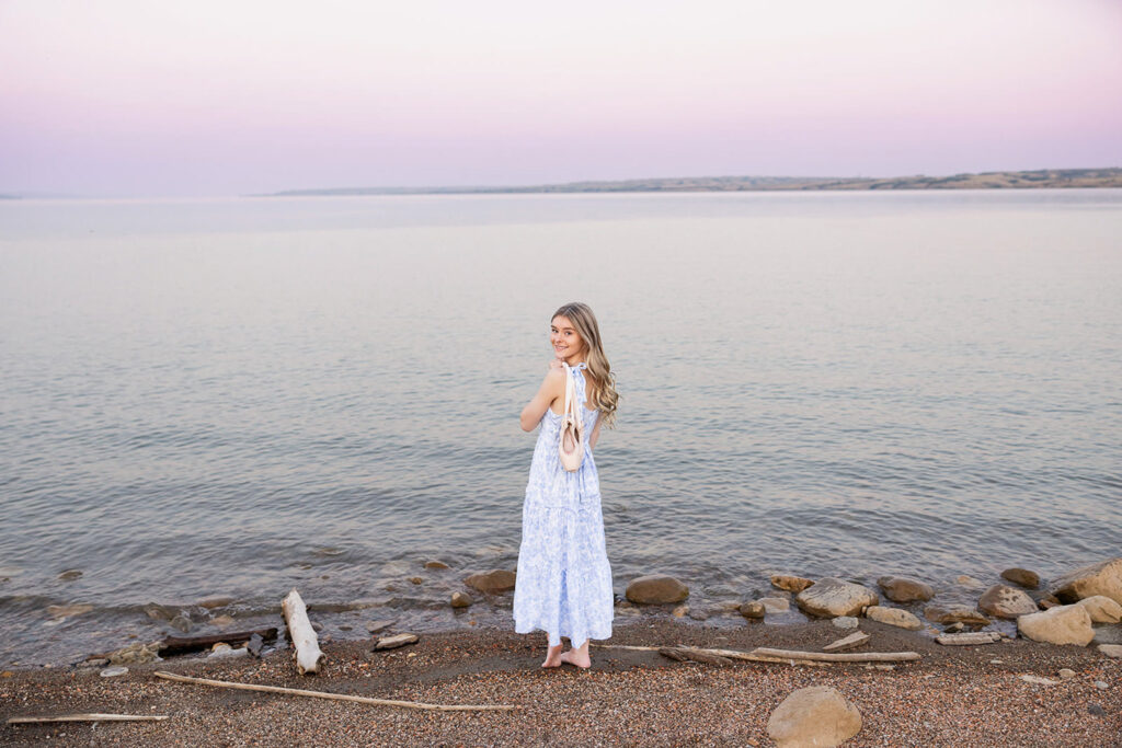 Williston High School senior Liv Mitson standing by the water at Lewis & Clark State Park.