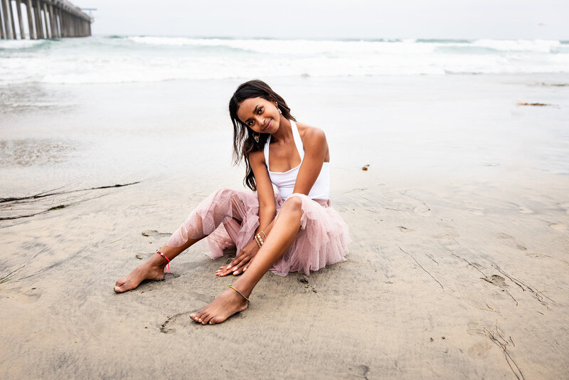 senior sitting on the beach - converting your website traffic into sales