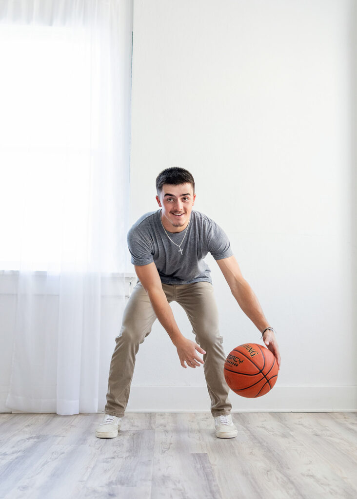 bouncing basketball in the studio, senior boy 