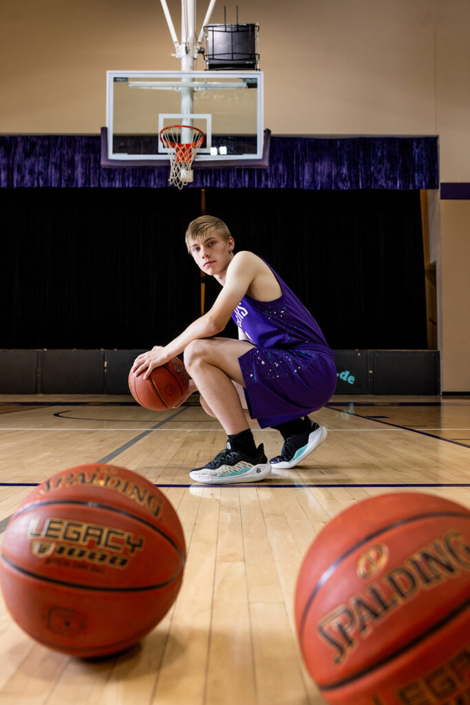 Grady dribbling basketball at Trinity High School court