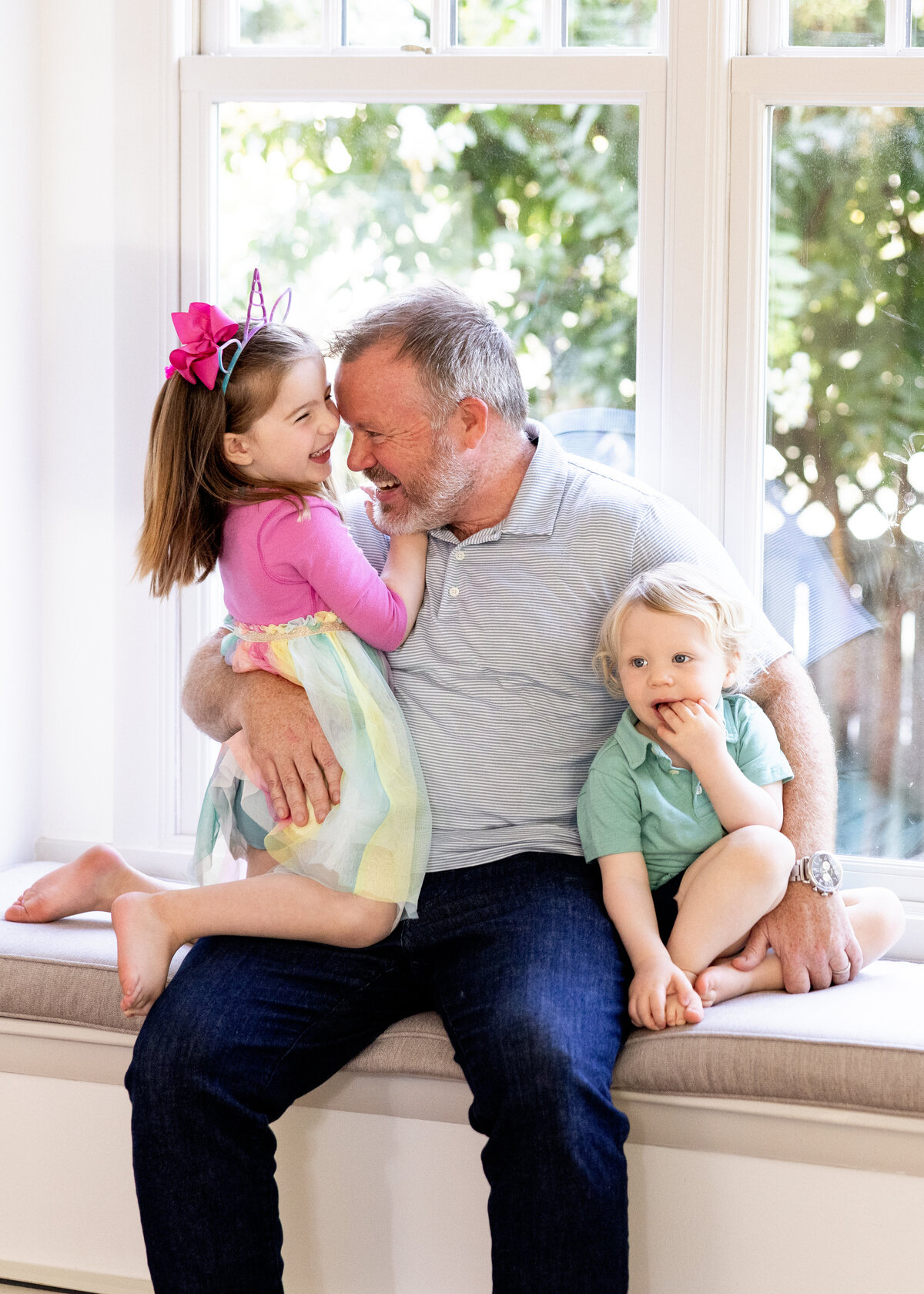 A joyful moment between a grandfather and his grandkids, full of laughter, light, and genuine connection.







