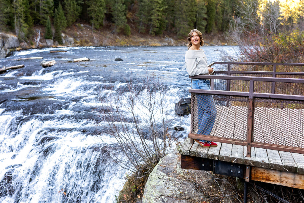 A ND senior is photographed next to Mesa Falls during her travel session with Kellie Rochelle Photography, a ND senior photographer