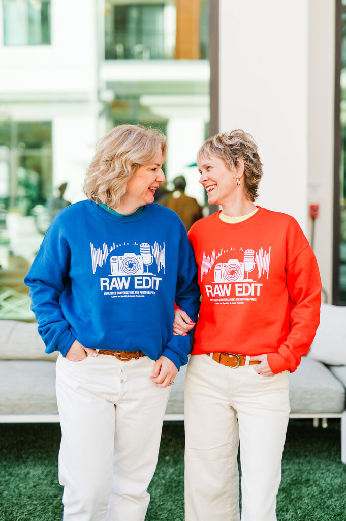 two photographers wearing the raw edit sweatshirts 