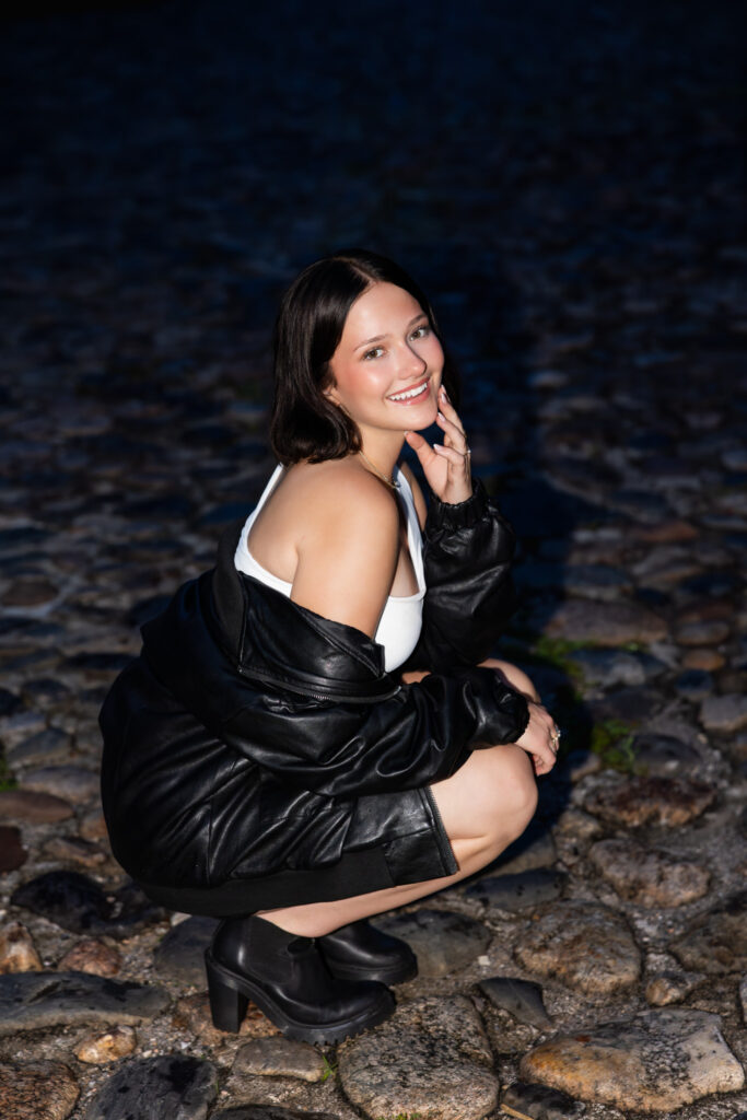 Editorial-style senior photo on Charleston’s iconic cobblestone street
