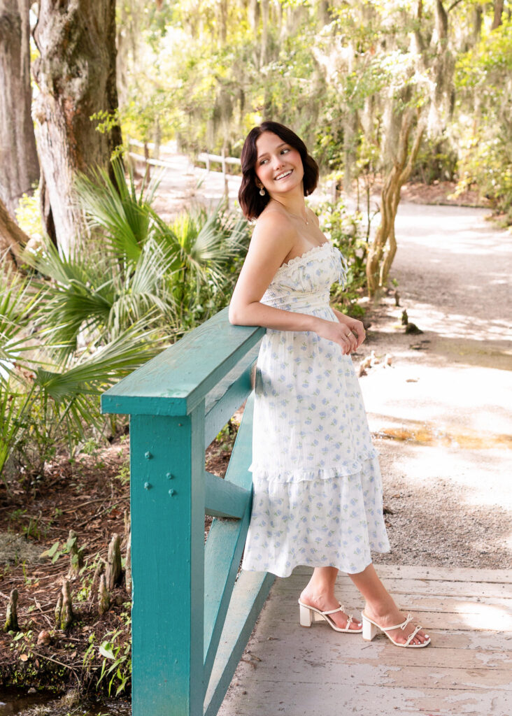 Elegant senior portrait in flowing dress at Magnolia Plantation
