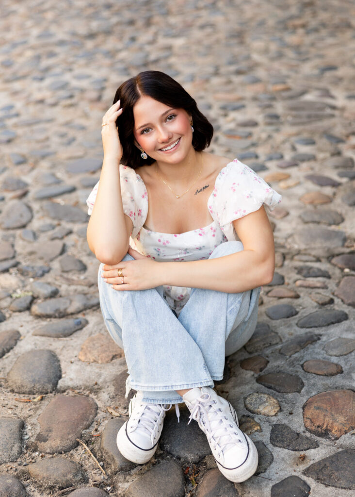 Senior photos taken on historic Rainbow Row in downtown Charleston
