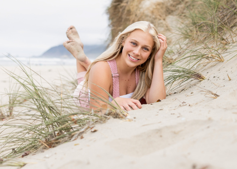 young woman laying on the beach during a destination shoot