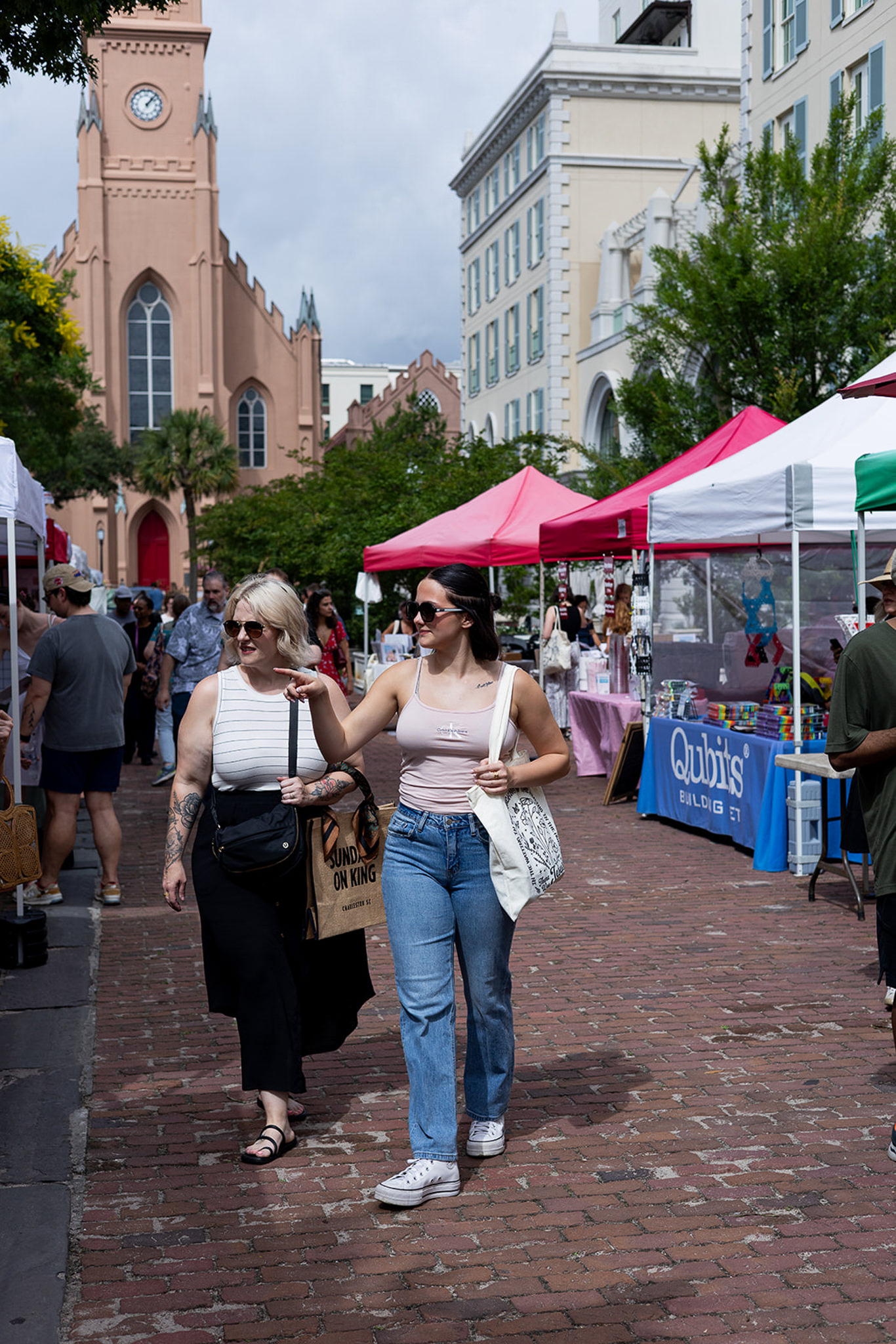 Mom & daughter walking at the Farmers Market in Charleston, SC