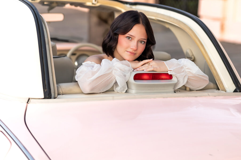Pink Figgy car photo shoot in front of pink house in charleston