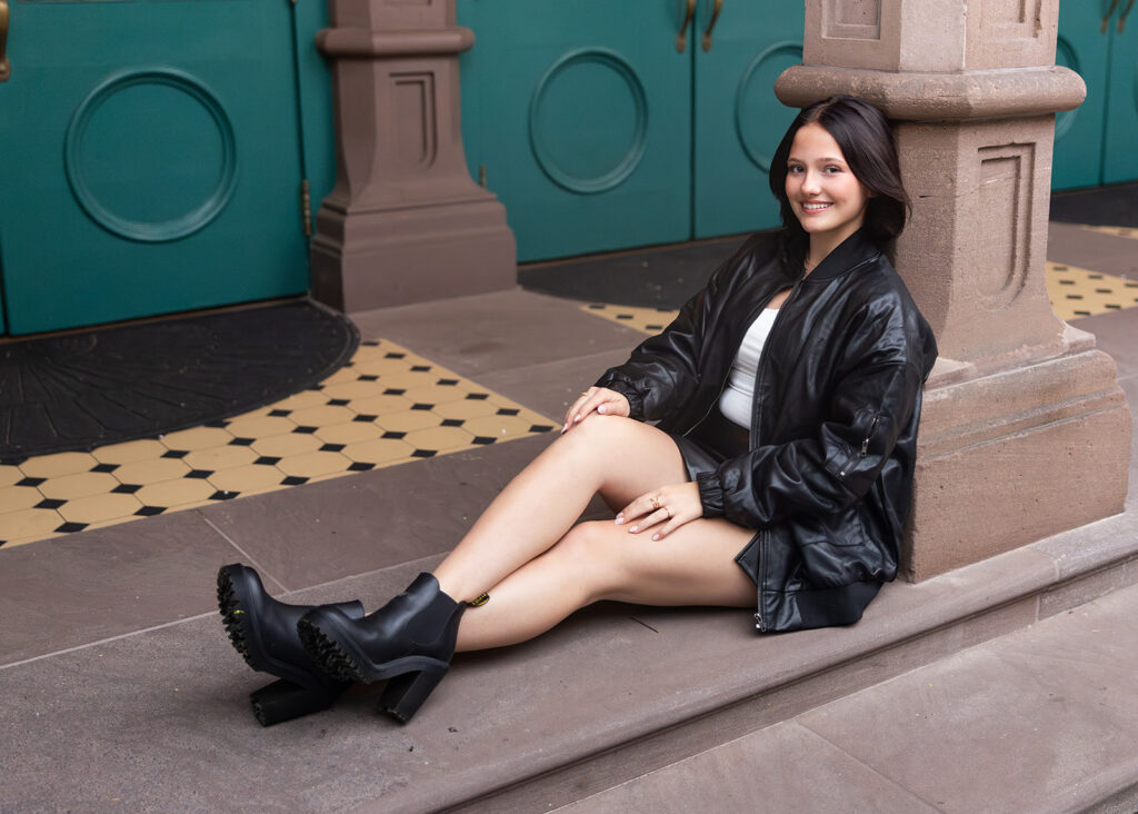 Downtown Senior Pictures Charleston SC featuring a leather skirt and boots 