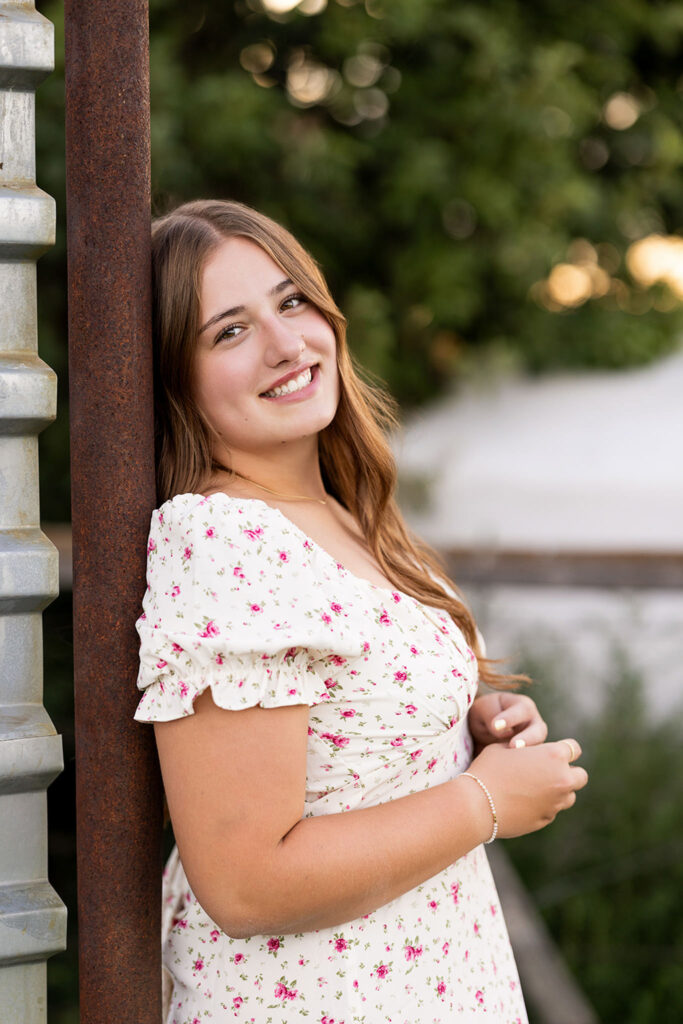Addison Hansen near a red barn on her grandparents farm in Bainville Montana