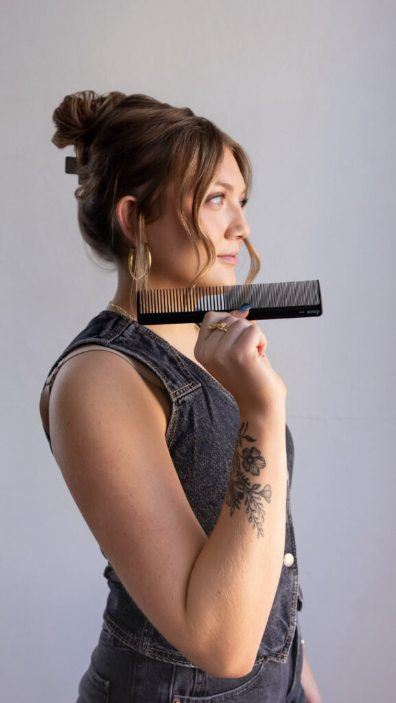 Portrait of woman holding comb, perfect for sessions you edit faster without compromising style.