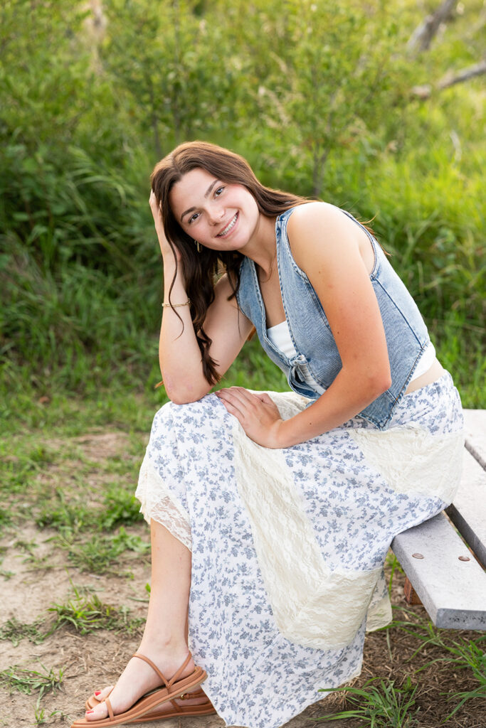 Senior girl sitting on a bench at Lewis & Clark State Park