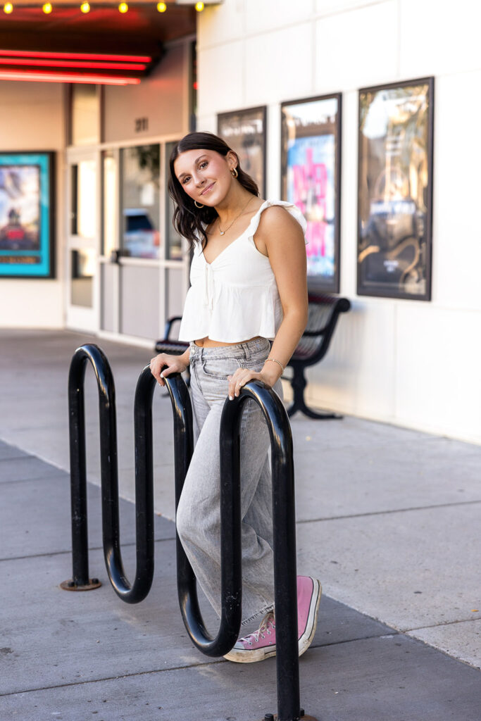 Addisyn's senior session in front of the theatre in Williston, nd