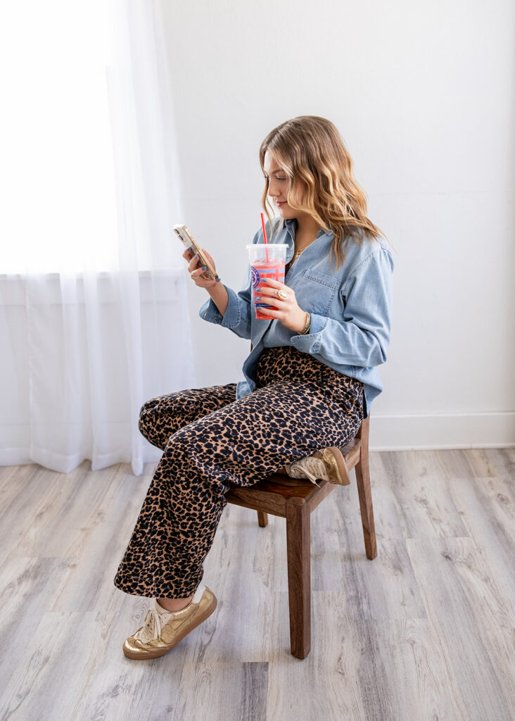 North Dakota cosmetology student in cheetah print and denim during branding session