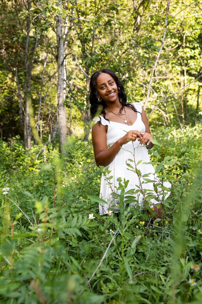 Senior walking horse trail during Glacier National Park senior photos