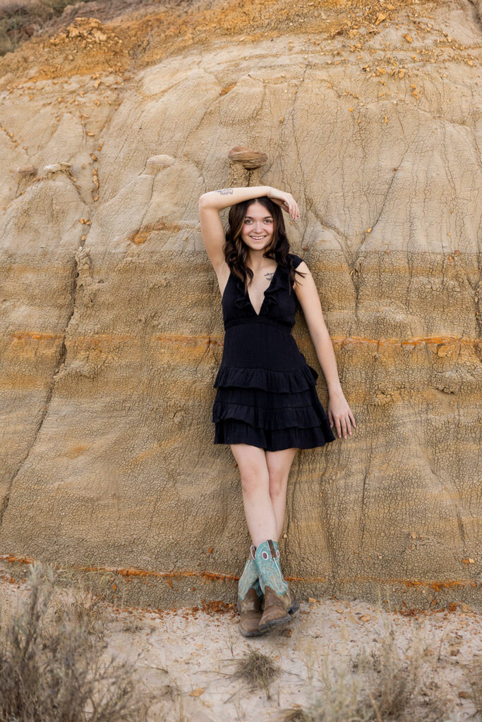 Danyn wearing black romper during outdoor senior session